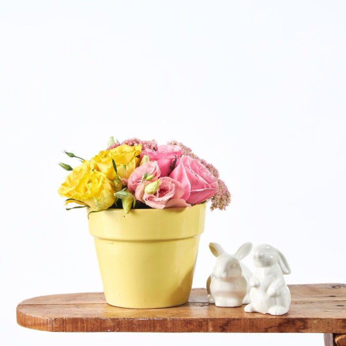 The Garden of Gentle Love - Fabulous Flowers & Gifts yellow pot with pink and yellow flowers and ceramic bunny Easter décor.