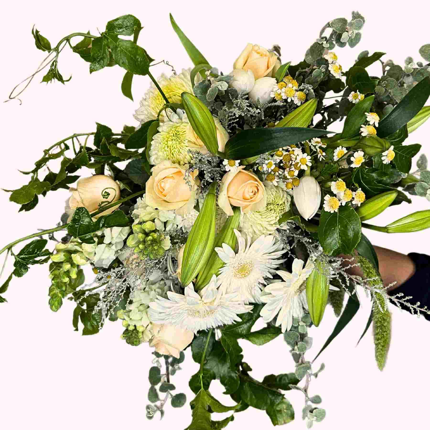 Lush bouquet featuring roses, gerberas, lilies, and an array of green foliage named Tracey's Flower Bouquet from Fabulous Flowers and Gifts
