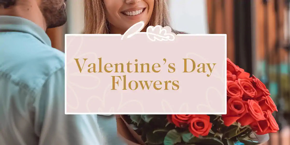 A happy couple exchanging a bouquet of red roses. Fabulous Flowers and Gifts - Valentine's Day Flowers