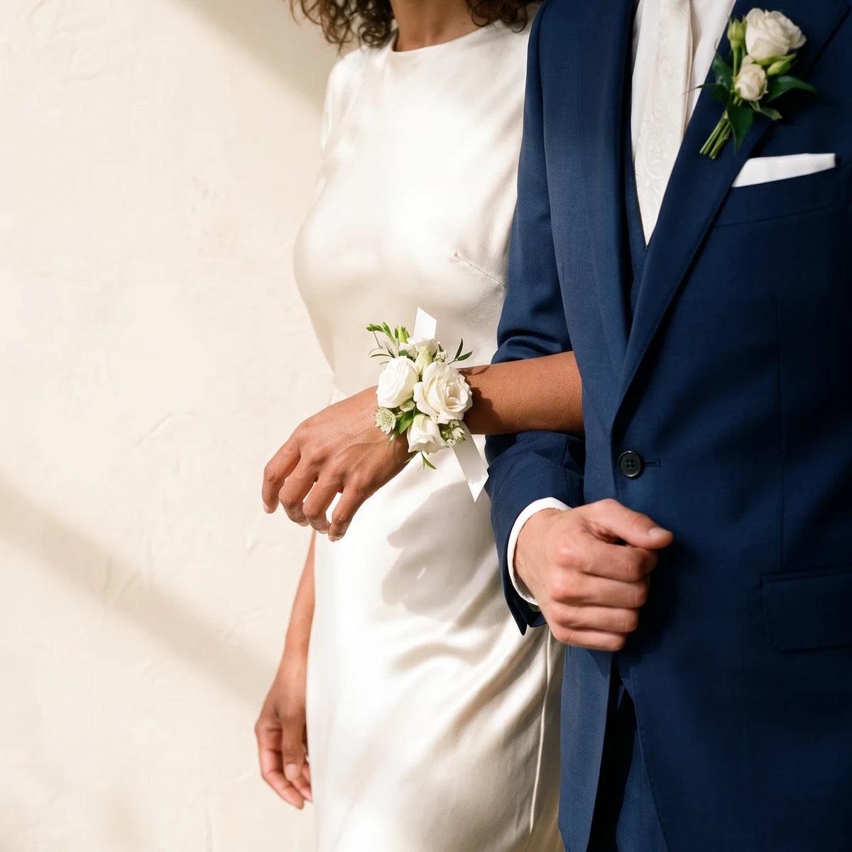 Couple arm in arm with a white rose wrist corsage and matching white boutonniere, Fabulous Flowers South Africa