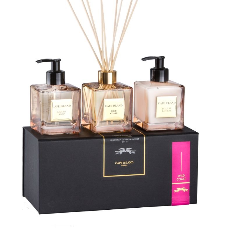 Cape Island diffuser set with two bottles and a reed diffuser on a black stand.
