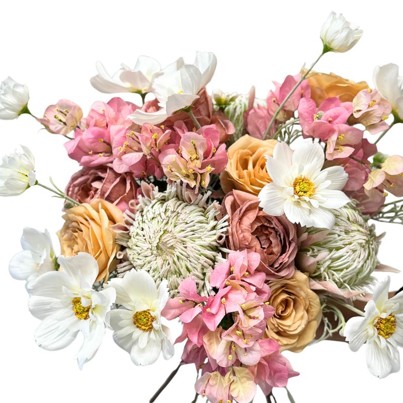 Bouquet of colorful flowers including roses and daisies on a white background