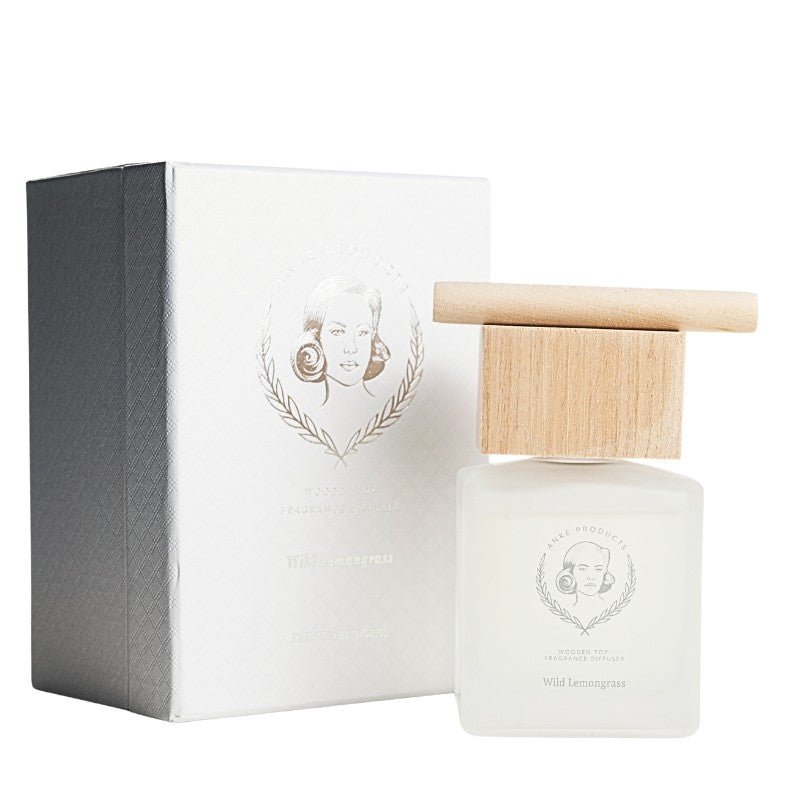 Perfume bottle with wooden cap and packaging on a white background