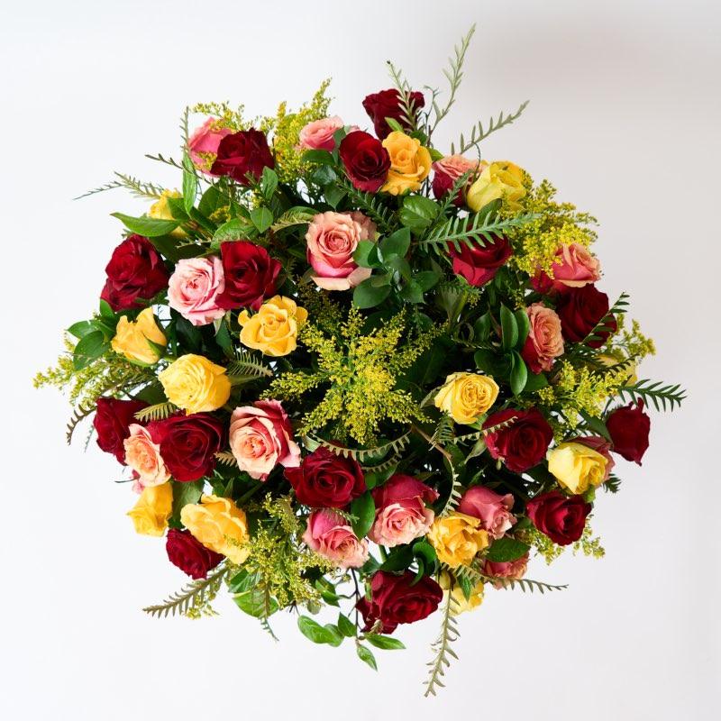 Golden Sunrise moments with this fresh red, orange and yellow rose arrangement for same day flower delivery from Fabulous Flowers and Gifts