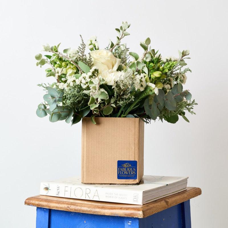 With soft whites, this beautiful fresh flower arrangement includes a mixture of fresh white blooms, which can consist of gorgeous stargazer lilies, Michaelmas daisies, white chrysanthemums, white Gerberas, white Roses, greenery, penny gum and white lisianthus from Fabulous Flowers Cape Town Florist