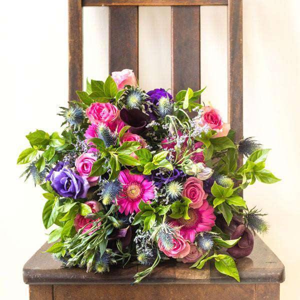 Hand-Selected Blooms including gerberas, roses and lisianthus in Berry Bloom Flower Bouquet