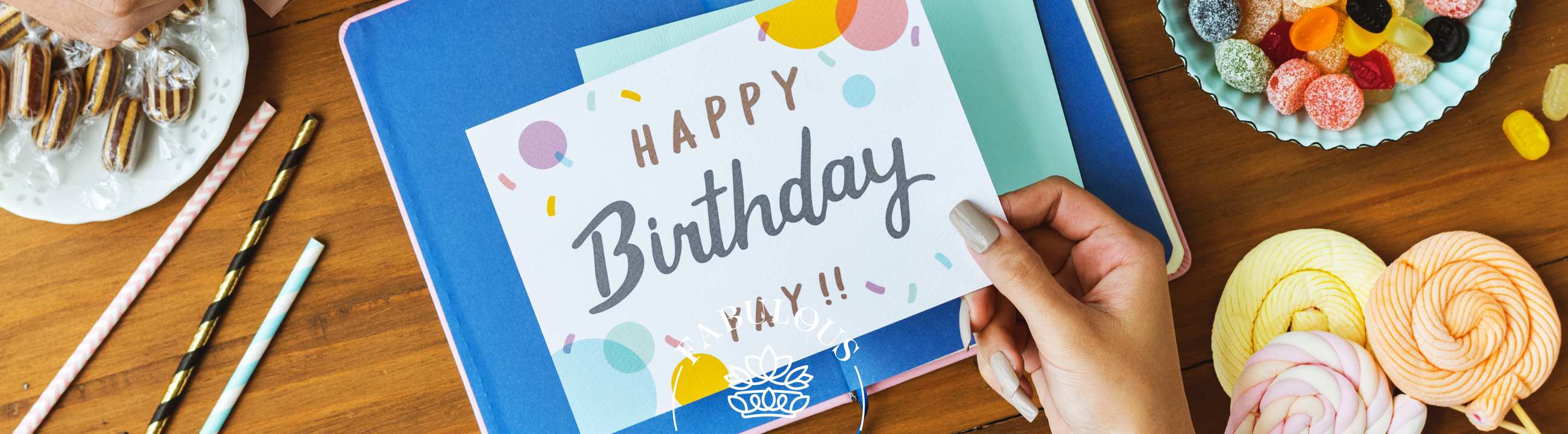 Birthday Wish for Boyfriend: Best Heartfelt and Romantic Ideas – hands holding “Happy Birthday” card with sweets, ribbons and gifts on table