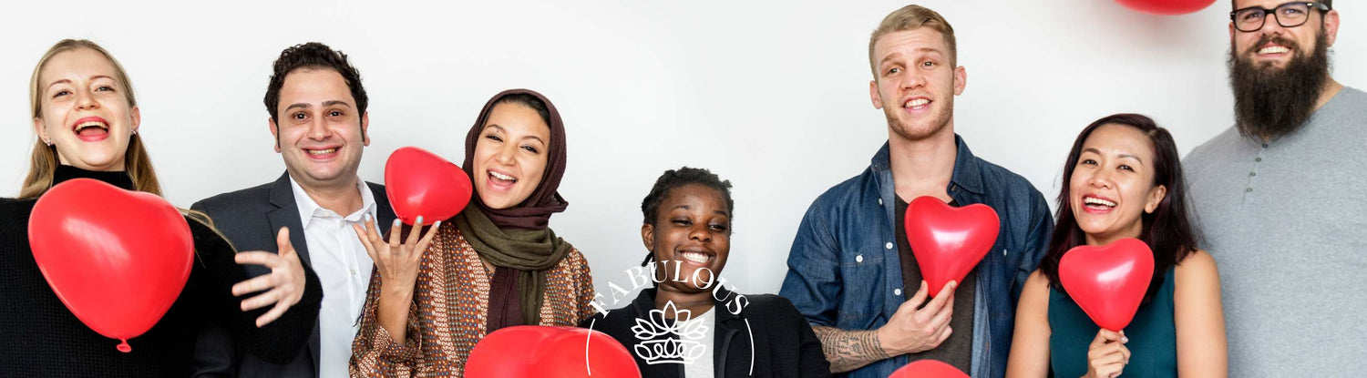 Valentines Messages for Friends: Sweet, Funny & Heartfelt Ideas — diverse friends smiling with red heart balloons on white background.