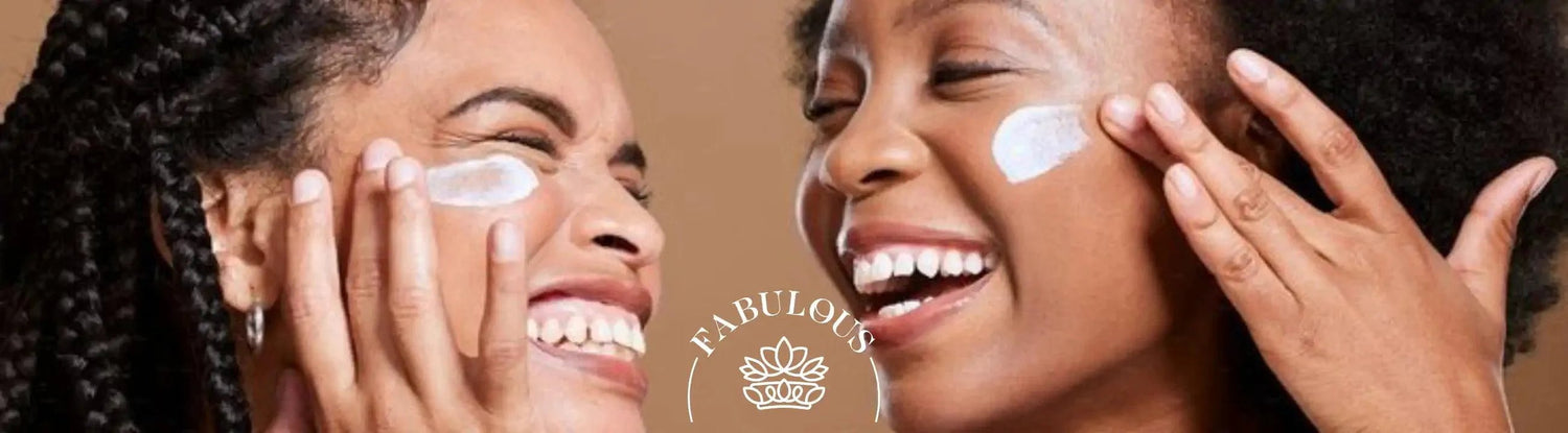 Two joyful women applying skincare cream to their faces - Fabulous Flowers & Gifts.