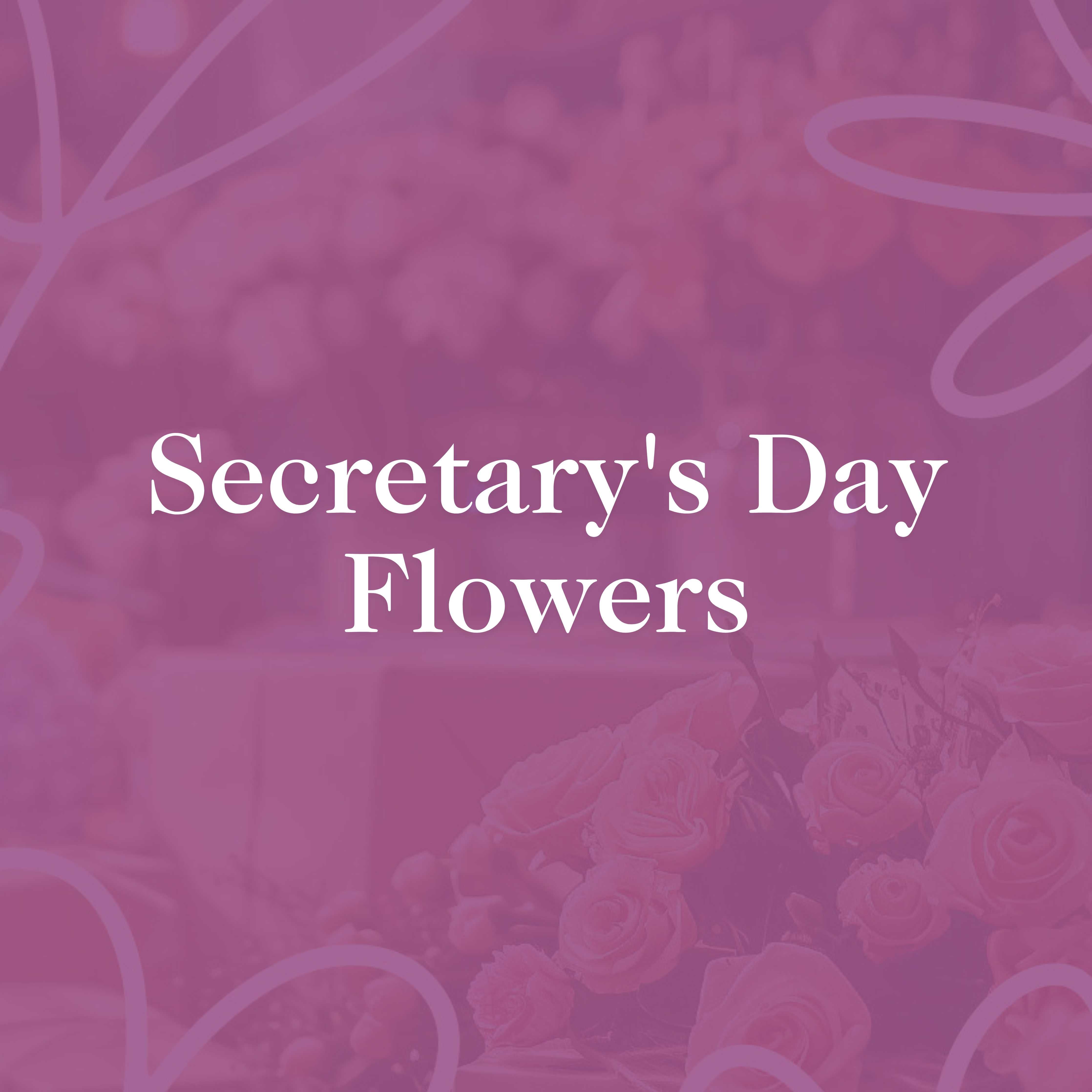 Promotional image titled 'Secretary's Day Flowers' featuring a soft pink background with elegant text overlay. The image includes a beautifully arranged bouquet of roses and other mixed flowers