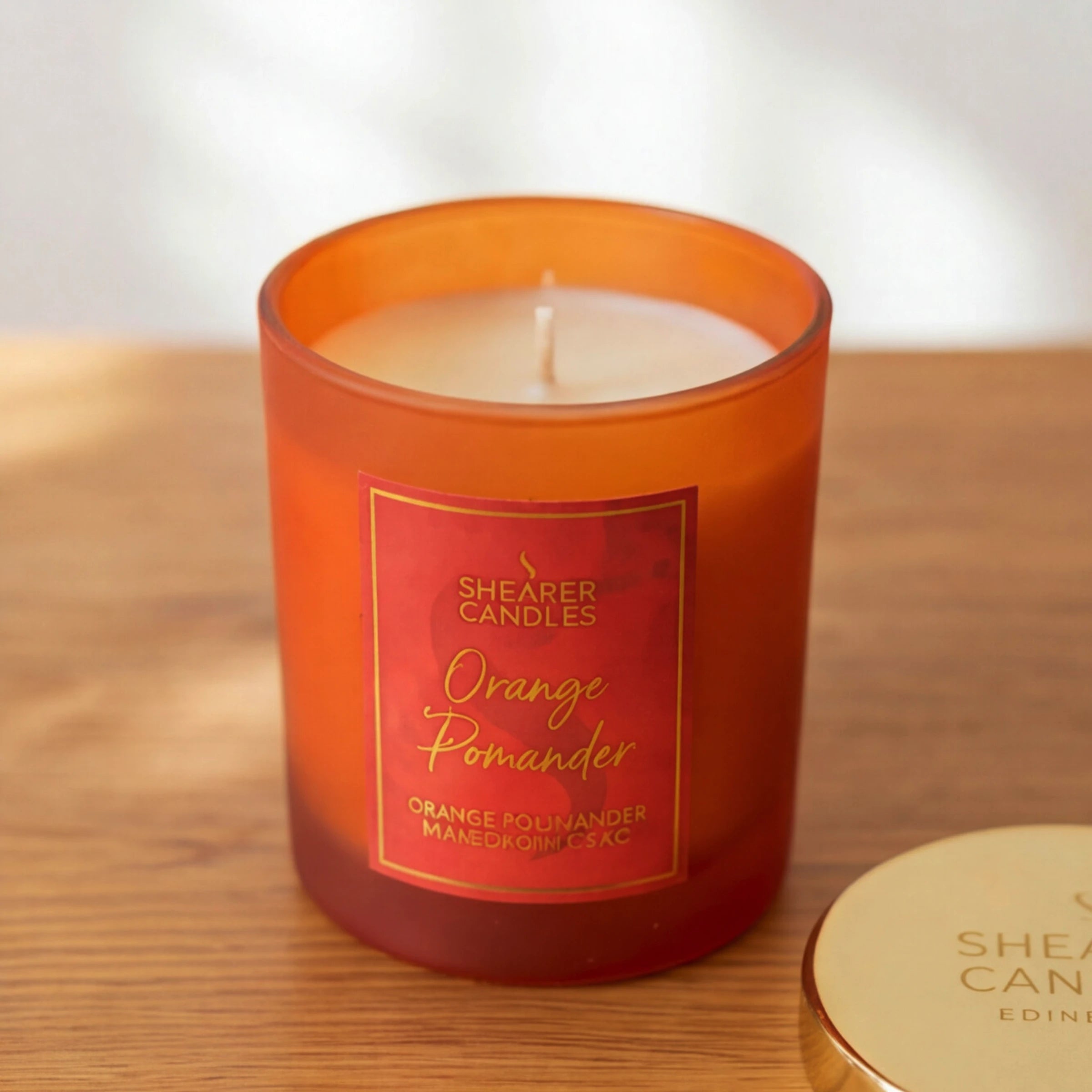 The Shearer Candles Orange Pomander candle from the Amber & Spice gift set, orange and spice scen