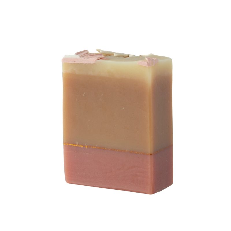 Two-tone soap bar with a gradient from beige to pink on a white background