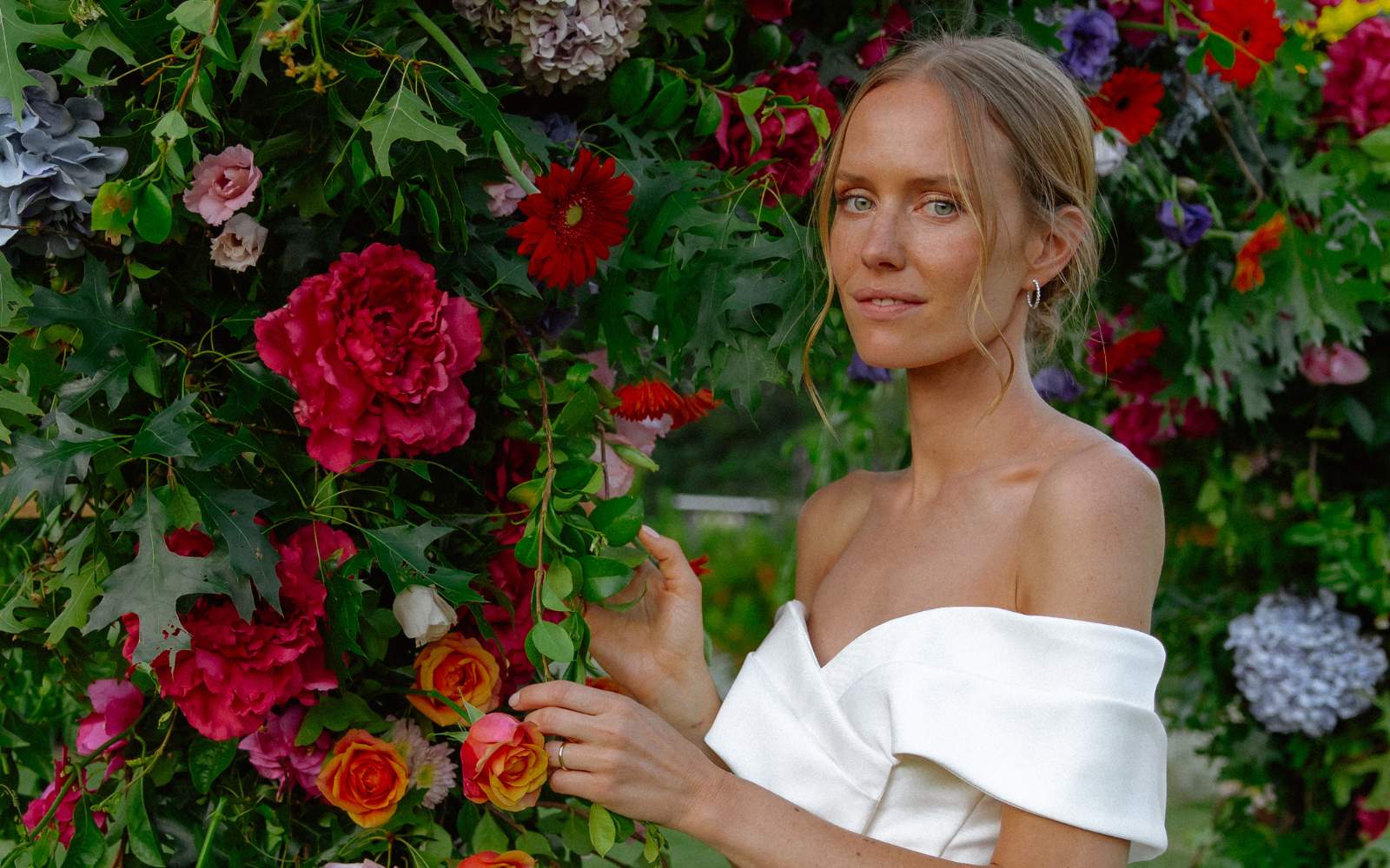 Bride with wedding arch for her wedding flowers - Constantia, Cape Town