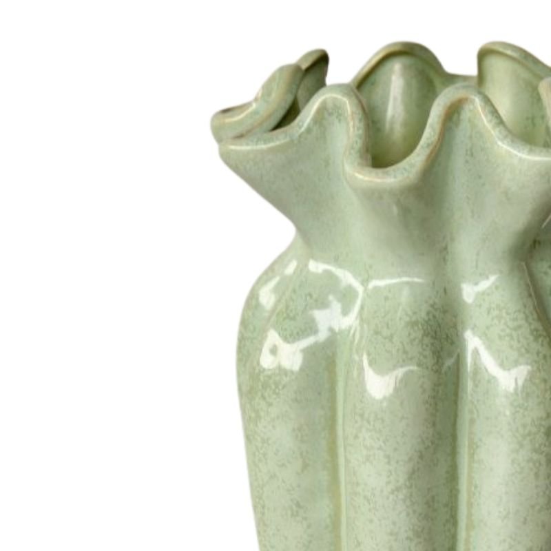 Green ceramic vase with ruffled design on a white background
