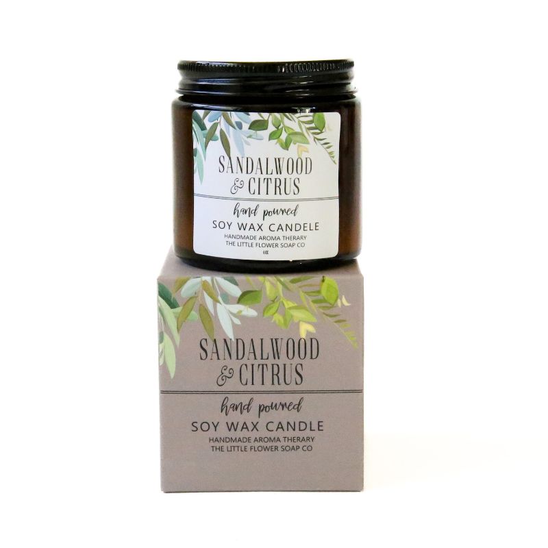 Sandalwood & Citrus candle with packaging on a white background
