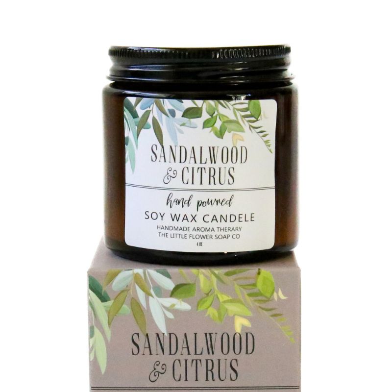 Sandalwood & Citrus soy wax candle with packaging on a white background