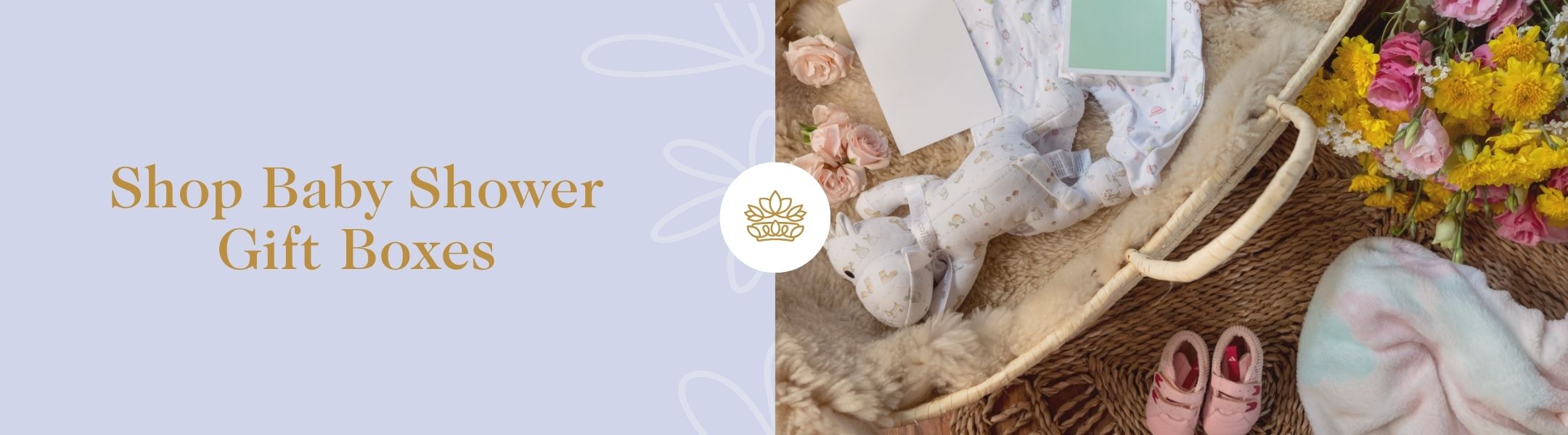 Yellow and pink flowers with baby gift items in a basket – Shop Baby Shower Gift Boxes by Fabulous Flowers and Gifts. 