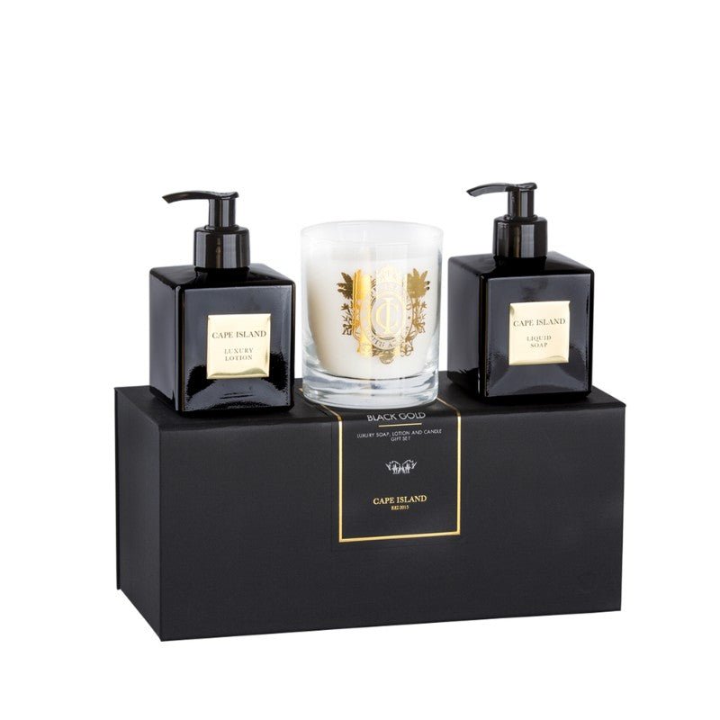 Two black bottles with pump dispensers and a white candle on a black stand with 'CAPE BLEND' branding.