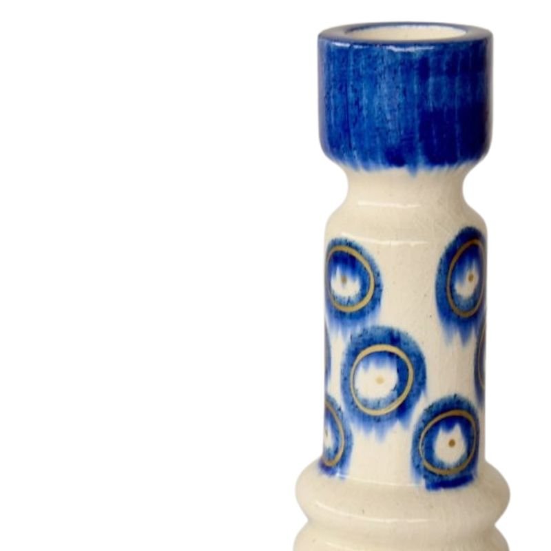 Ceramic vase with blue and white pattern on a white background