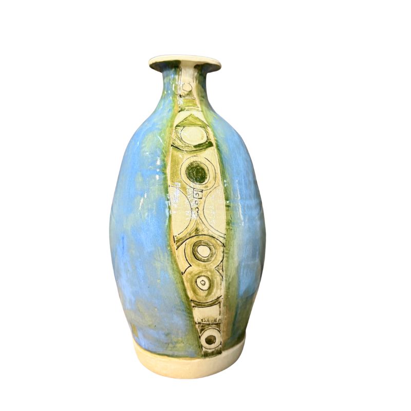 Decorative vase with gold and green design on a white background