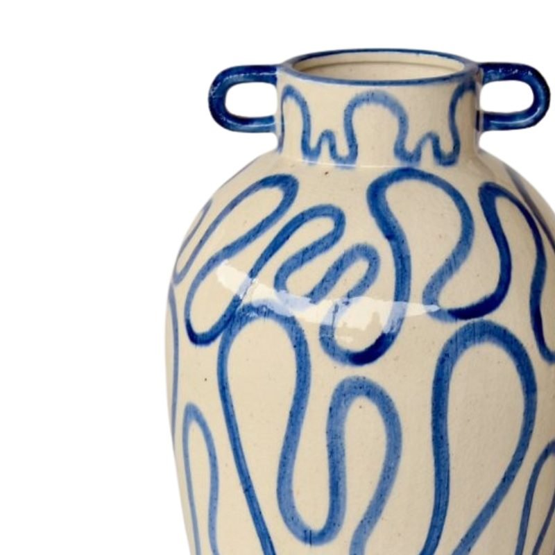 Ceramic vase with blue abstract patterns on a white background