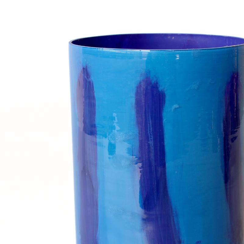 Blue cylindrical object on a white background