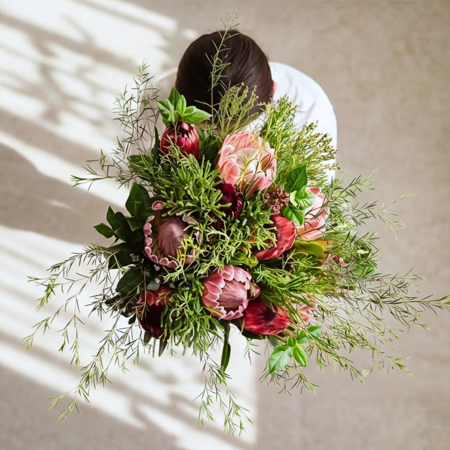 Top-down view of the Cape Town Protea Bouquet, proteas and wild fynbos greenery