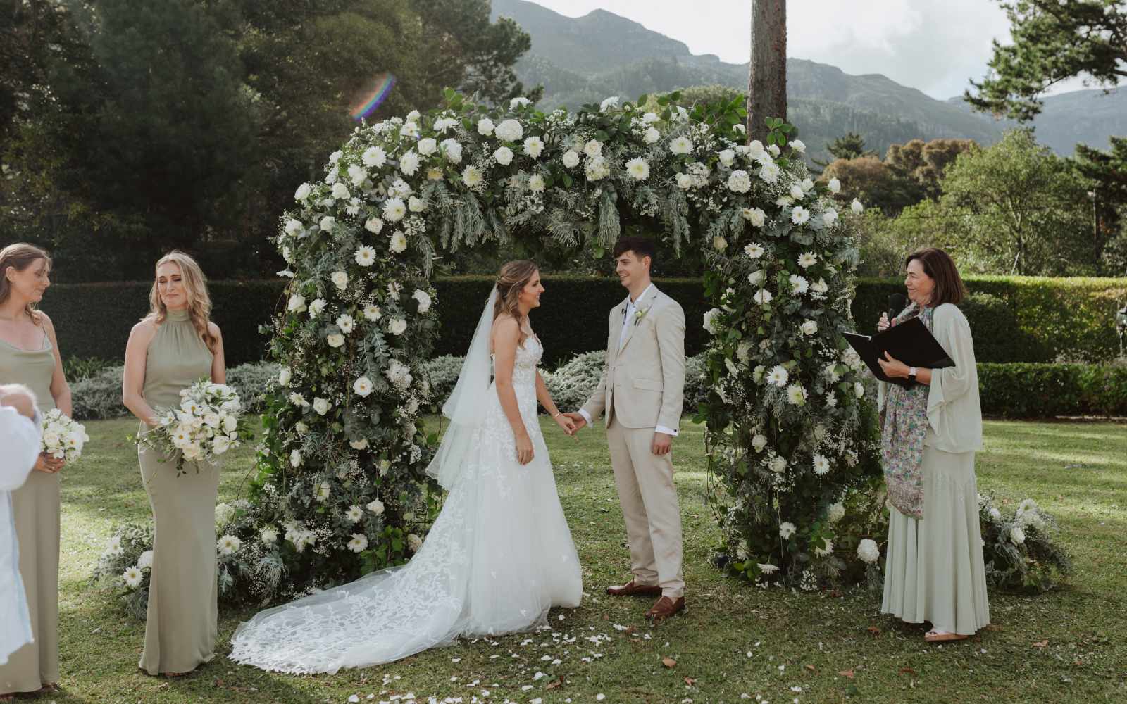 White and green wedding flowers - Fabulous Flowers, flower arch, bride and groom