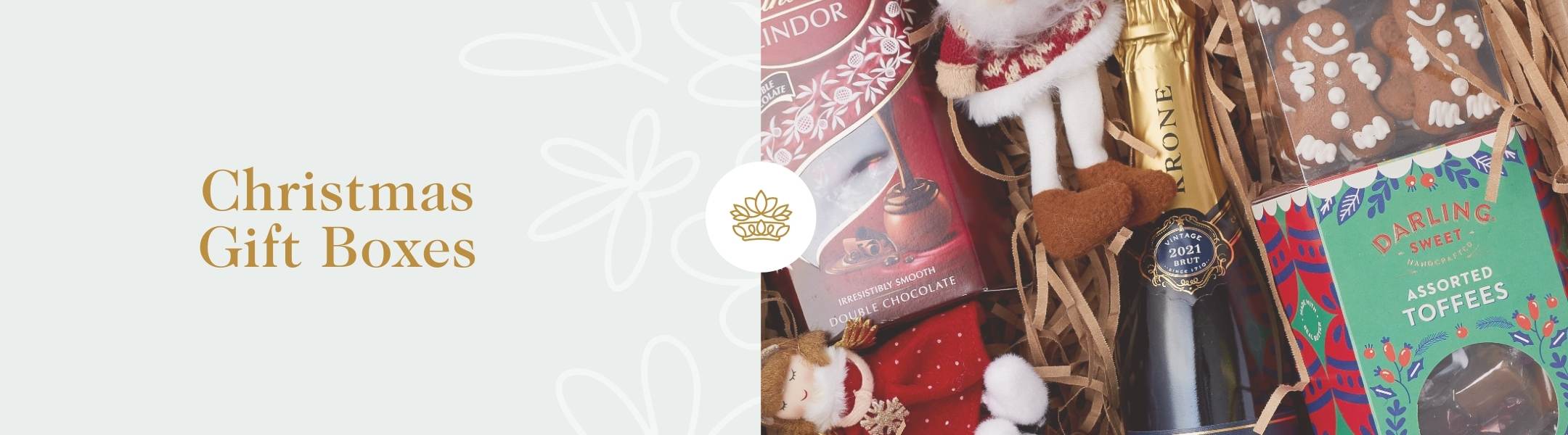 Fabulous Flowers & Gifts holiday gift box featuring gingerbread cookies, chocolates, and festive decorations.