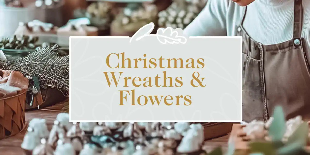 A cosy living room beautifully decorated with a Christmas tree and festive ornaments. Fabulous Flowers and Gifts - Christmas