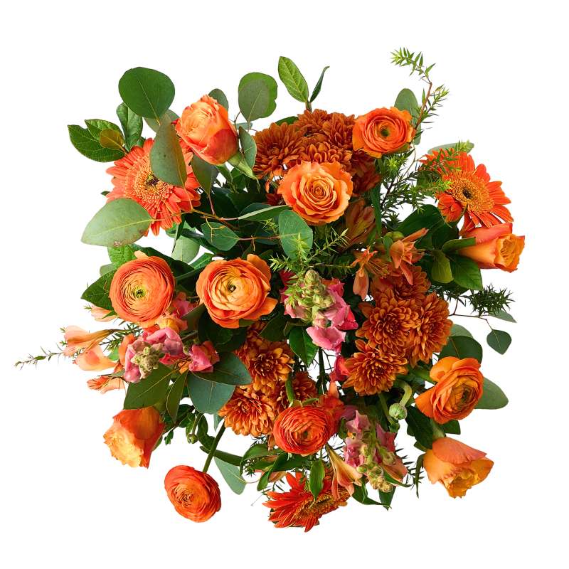 Citrus Couture Flower Arrangement bouquet top view featuring warm orange blooms, chrysanthemums and greenery