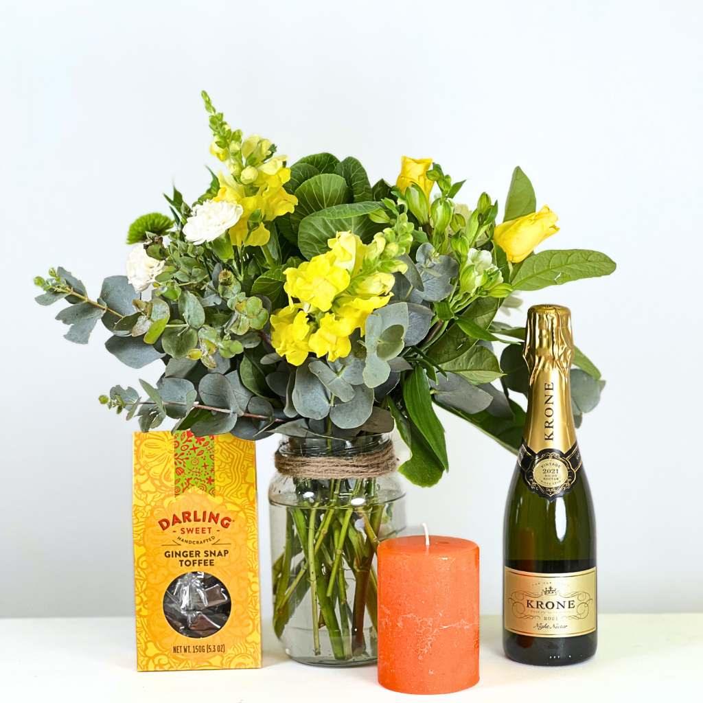 Sustainable Yellow Flower Arrangement with candle and champagne | Fabulous Flowers and Gifts