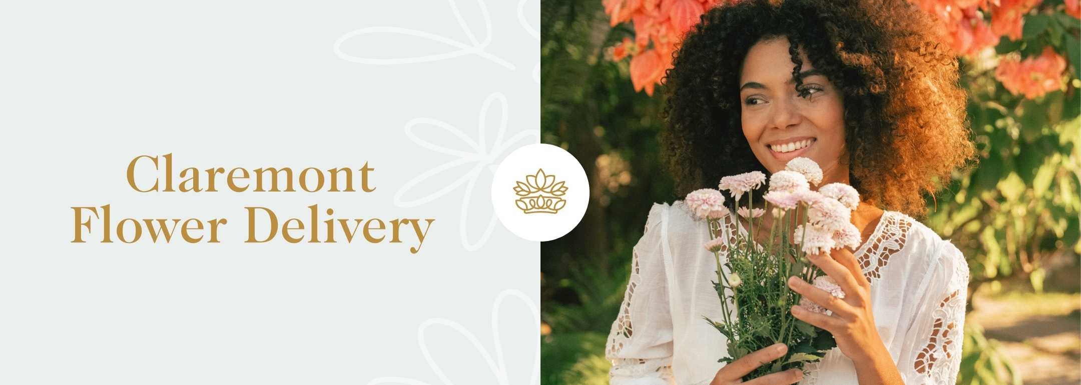 Wide banner image featuring a smiling African woman in a white lace dress, joyfully holding a bouquet of pink flowers. She stands in a lush garden with vibrant orange flowers in the background. The image highlights 'Claremont Flower Delivery' with elegant gold text and a delicate white floral logo