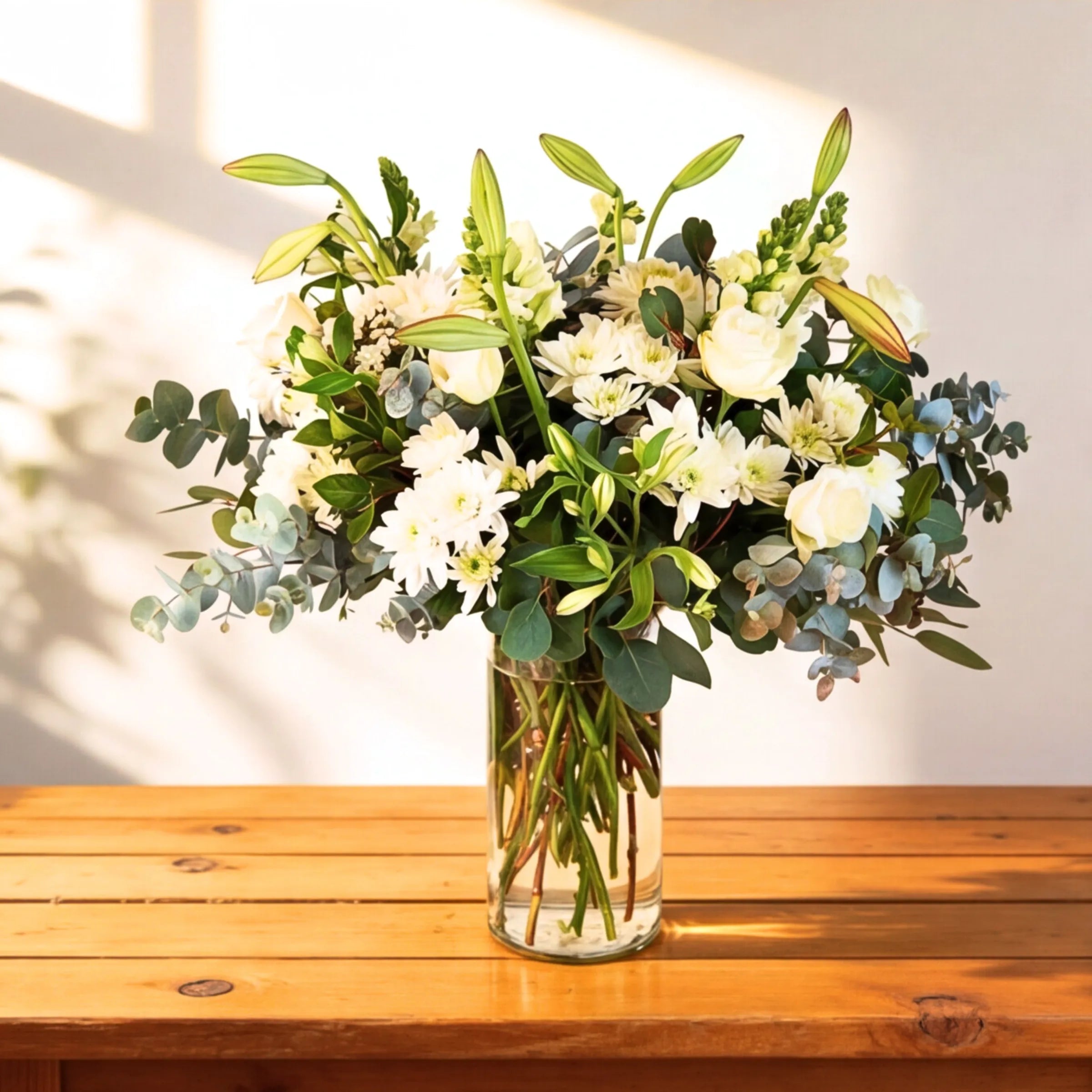 White and green flower arrangement with roses, chrysanthemums, lilies and eucalyptus in a glass vase, same-day CPT and Joburg