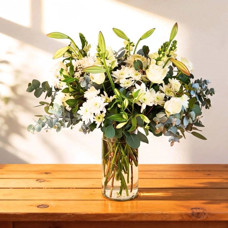 White and green flower arrangement with roses, chrysanthemums, lilies and eucalyptus in a glass vase, same-day CPT and Joburg