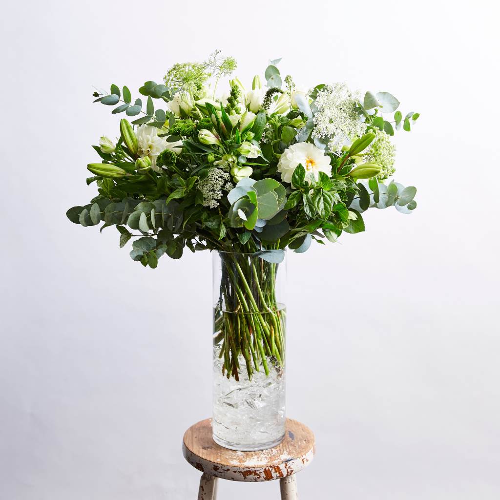 Classic white flower arrangement with dahlias, lilies, roses and pennygum by Fabulous Flowers
