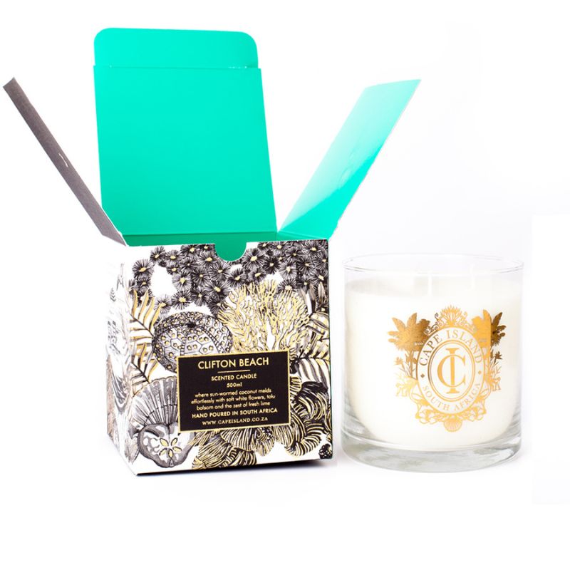 Candle with packaging labeled 'Clifton Beach' on a white background