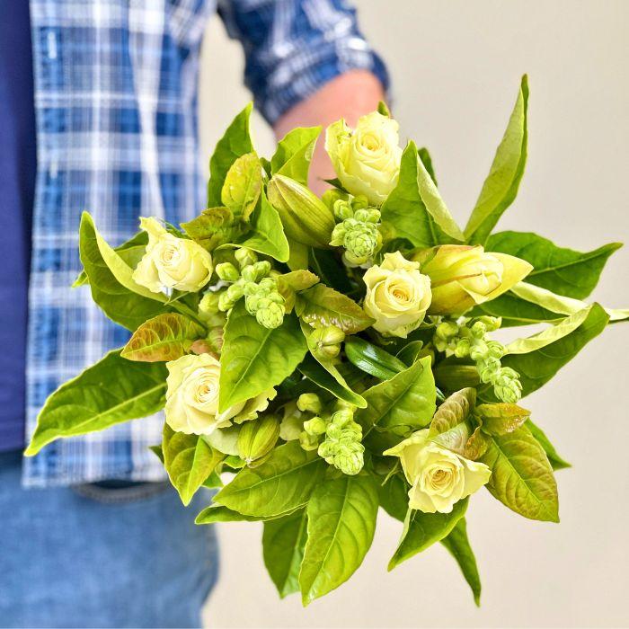 Company Gardens Glamour Bouquet – fresh white roses and lush green leaves, hand-held for delivery by Fabulous Flowers & Gifts