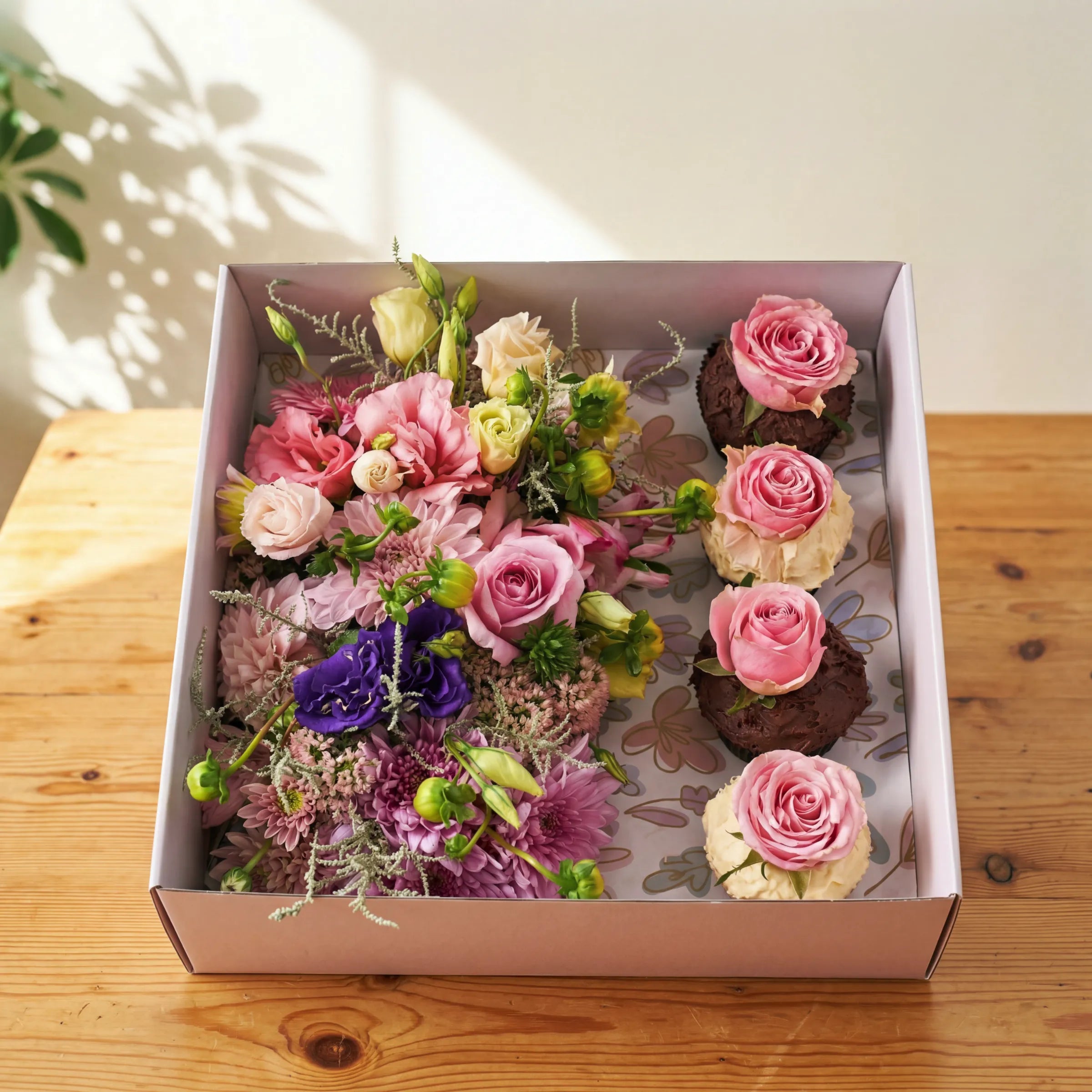 Cupcake Bloom Box with pink roses and chocolate cupcakes topped with fresh roses by Fabulous Flowers Cape Town