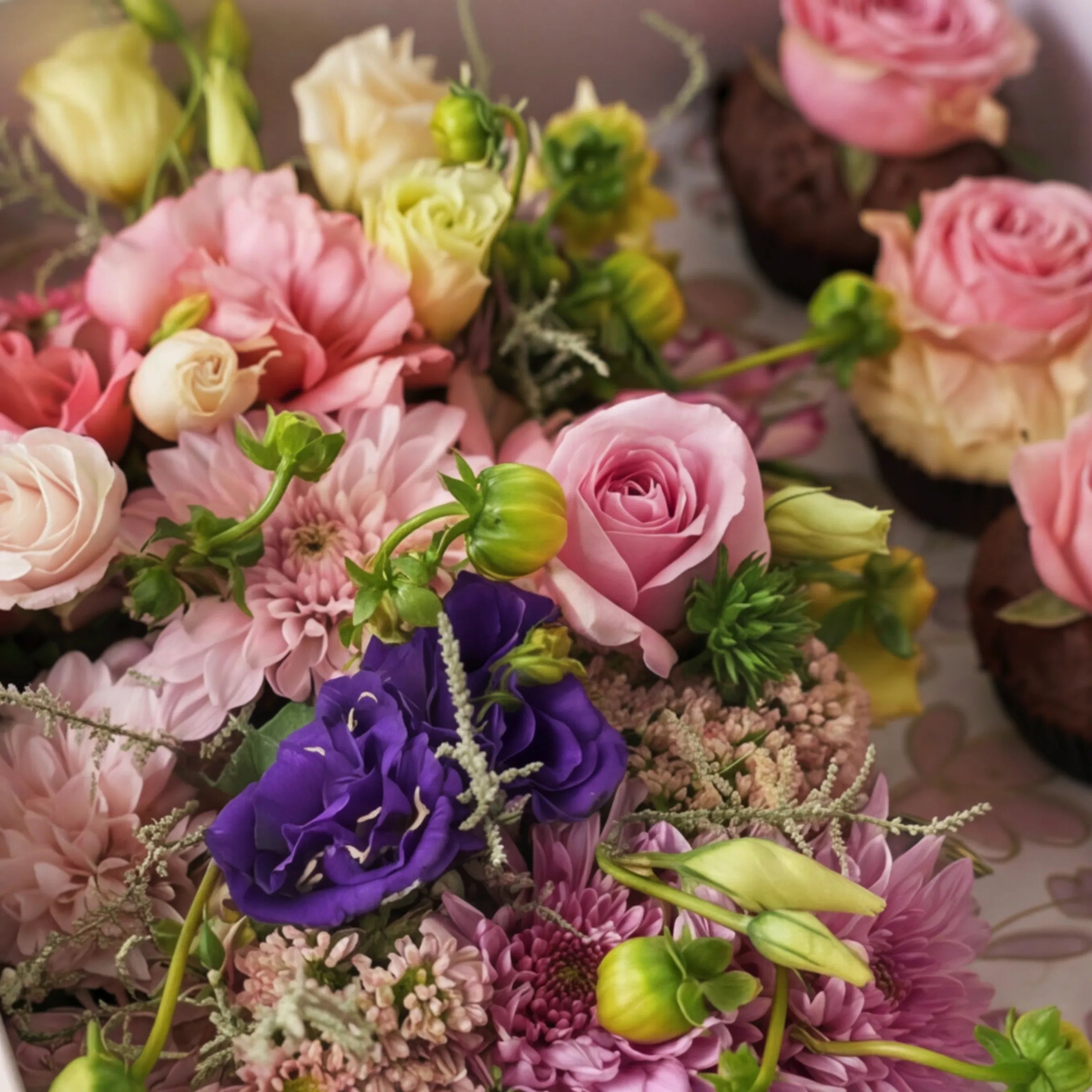 Macro of pink roses, purple lisianthus and dahlias in Cupcake Bloom Box by Fabulous Flowers Claremont