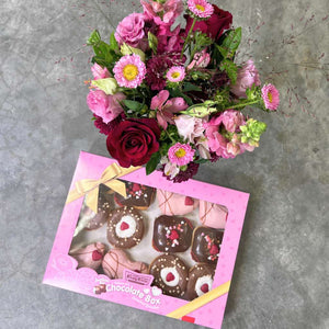 Elegant Doughnuts and Blooms Box with pink lisianthus and red roses - Fabulous Flowers and Gifts