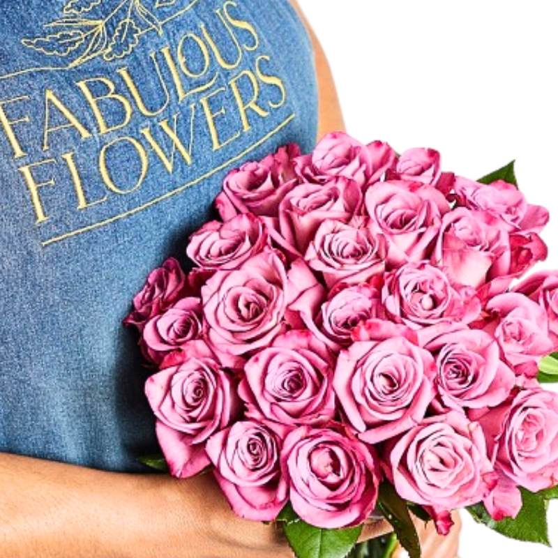 Person holding a bouquet of pink roses with 'Fabulous Flowers' branding in the background.