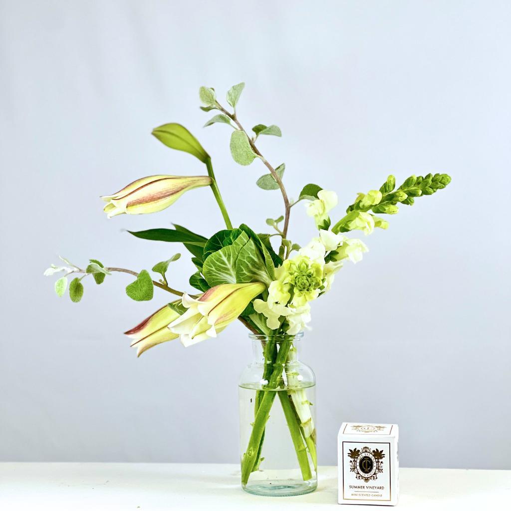 Elegant Fragrance Gift Set with white snapdragins, St Joseph lilies and greenery in a glass jar with a Cape Island candle - Fabulous Flowers