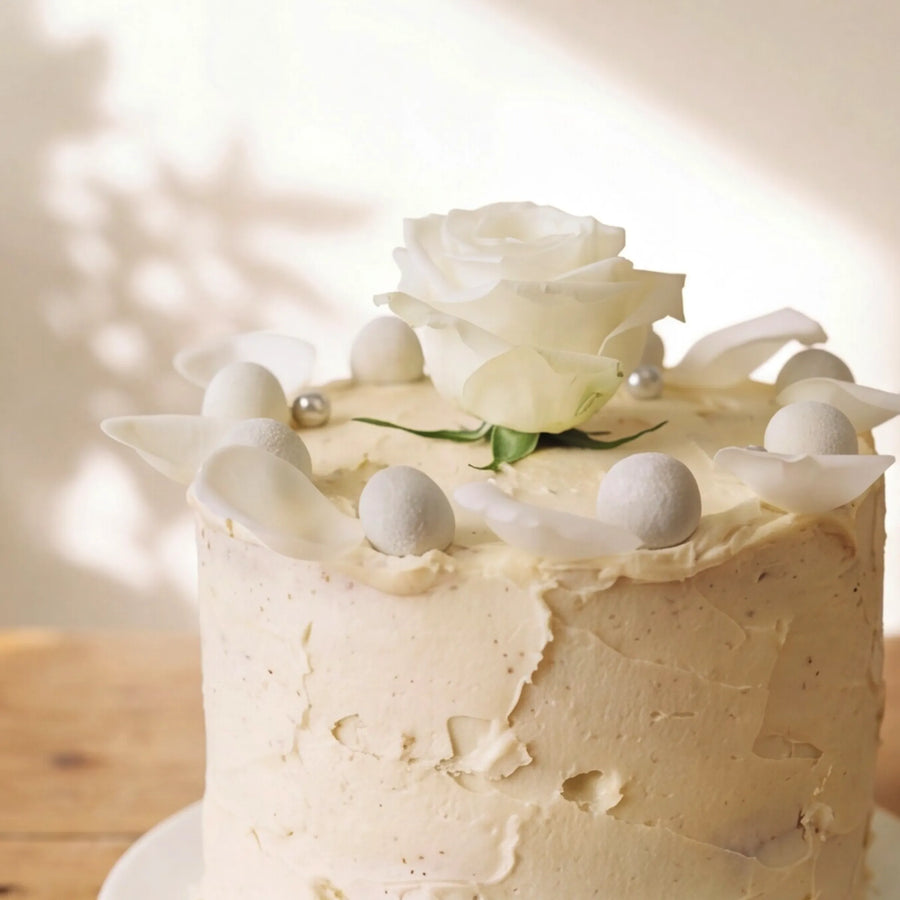 Macro of white rose petals and silver pearls on Elegant Rose Celebration Cake by Fabulous Flowers Cape Town