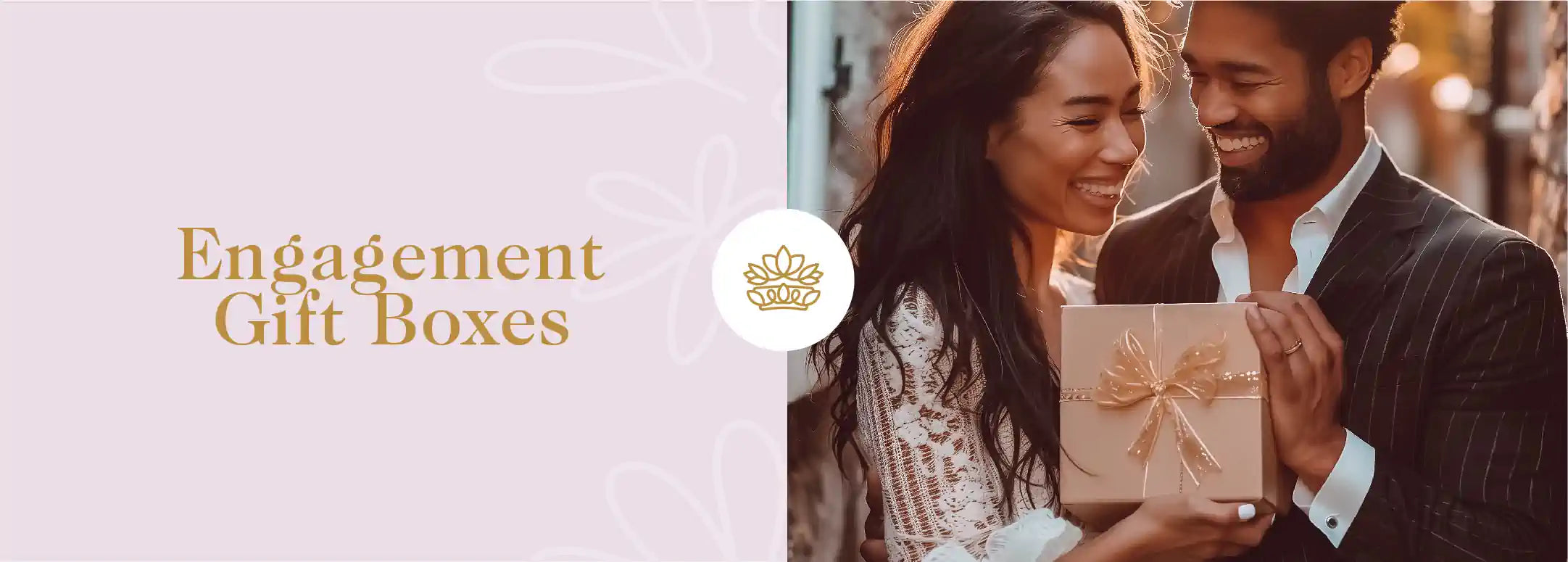 A radiant couple sharing a joyous moment with an elegant engagement gift box, embodying the happiness of commitment, provided by Fabulous Flowers and Gifts.