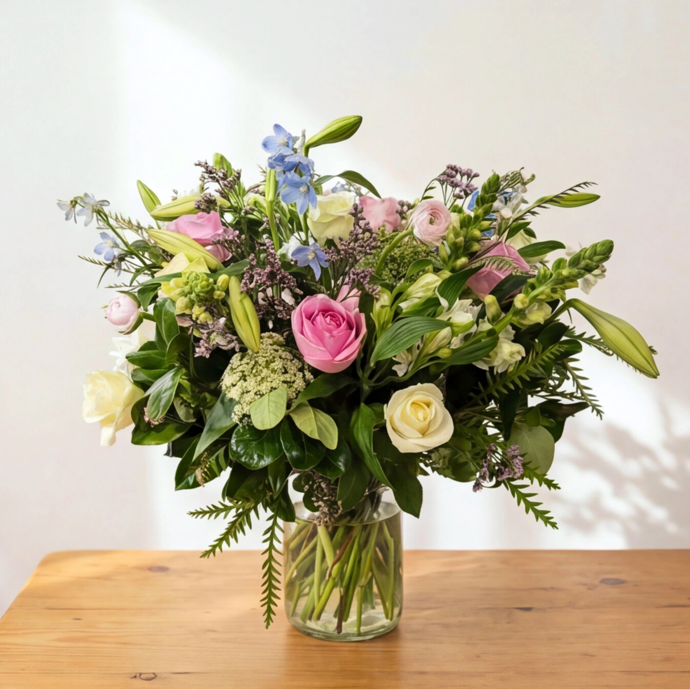 English Garden pastel flower arrangement in a clear glass vase, arranged by a Cape Town florist for same-day delivery