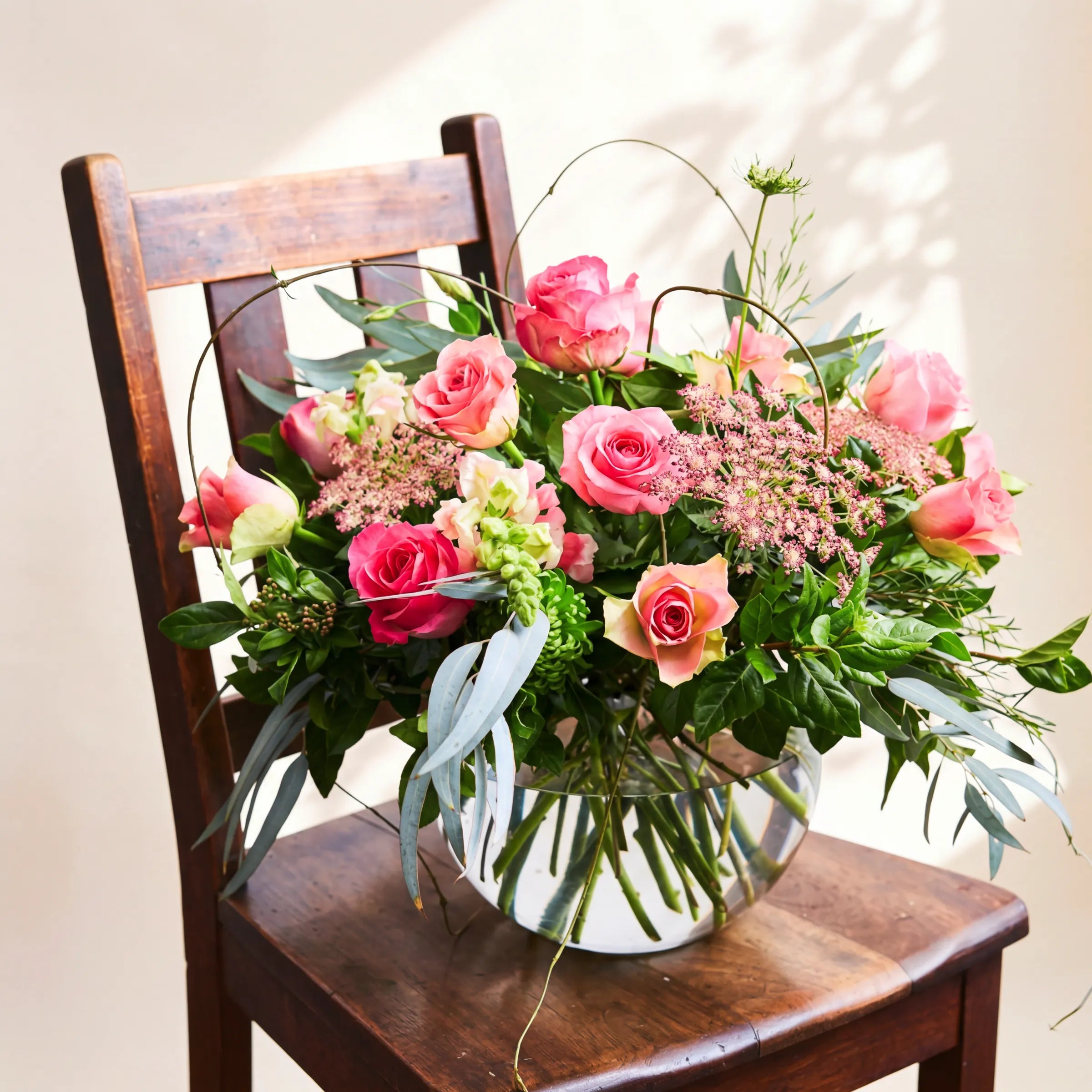 Fabulous Rose Bowl with pink roses and curly willow in glass fish-bowl by Fabulous Flowers Cape Town since 1999