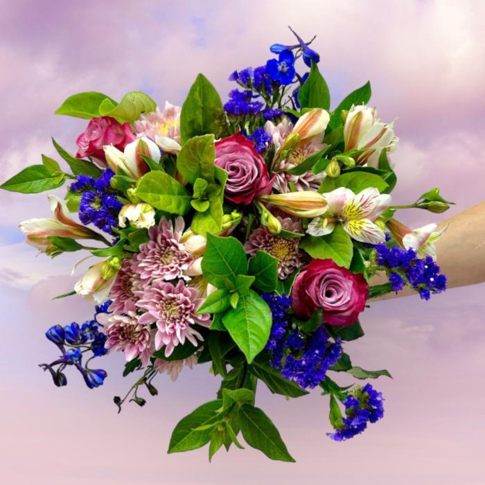 Bouquet of colorful flowers with a soft purple background