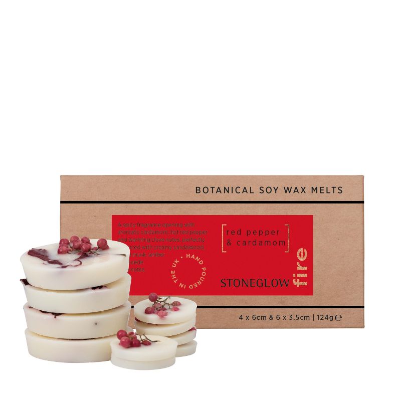 Stack of white wax melts with red berries next to a cardboard box labeled 'Botanical Soy Wax Melts' by Stoneglow on a white background.