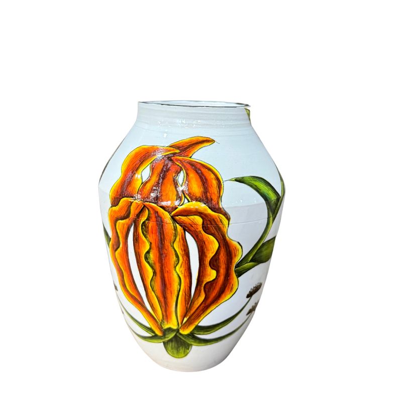 Decorative glass vase with floral design on a white background